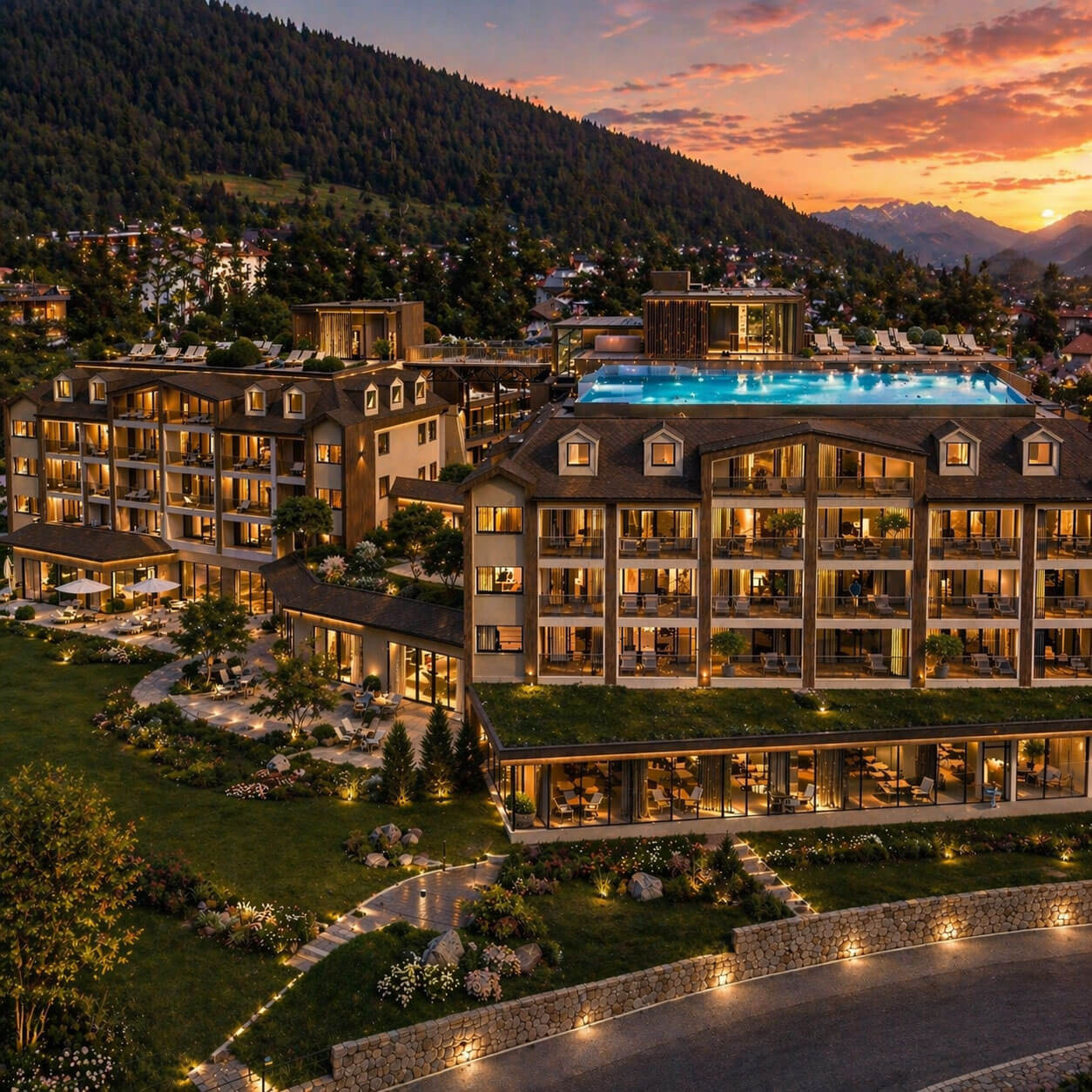 Ein modernes Hotel mit einem Pool auf dem Dach, der bei Sonnenuntergang beleuchtet wird, vor der Kulisse der Berge und einer Stadt am Hang. - Majestic Resorts (Relaunch)